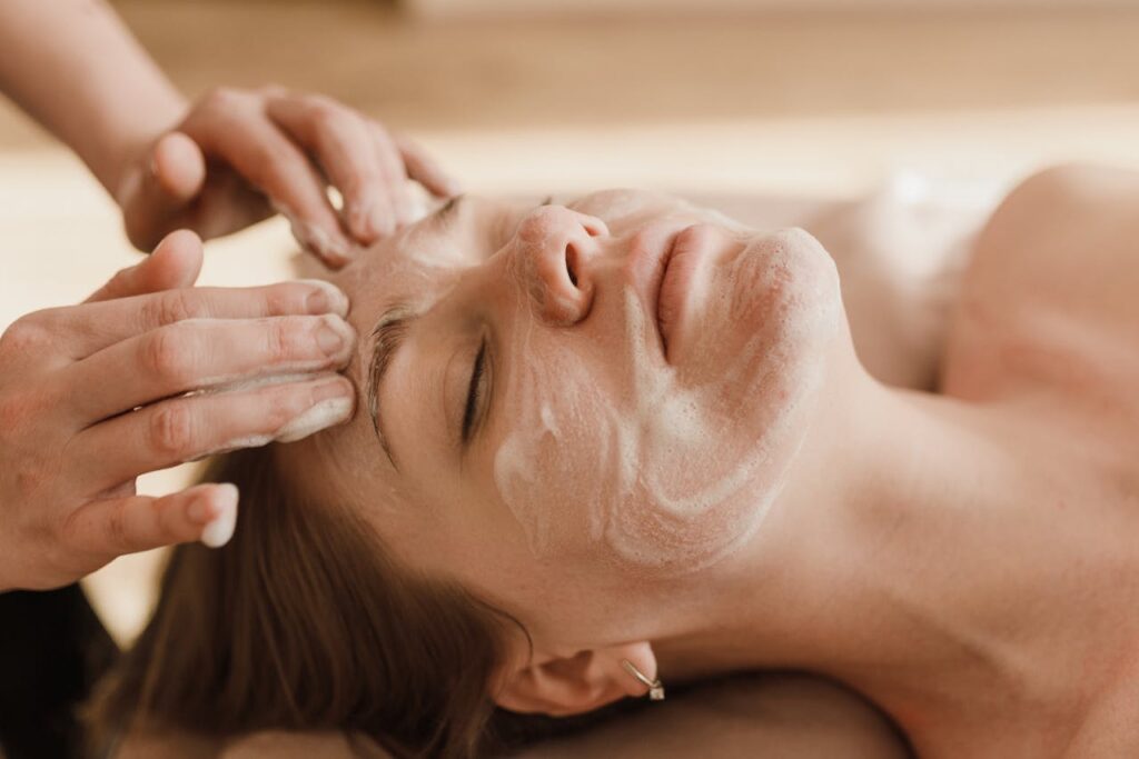 A lady recevies a foaming facial cleanse